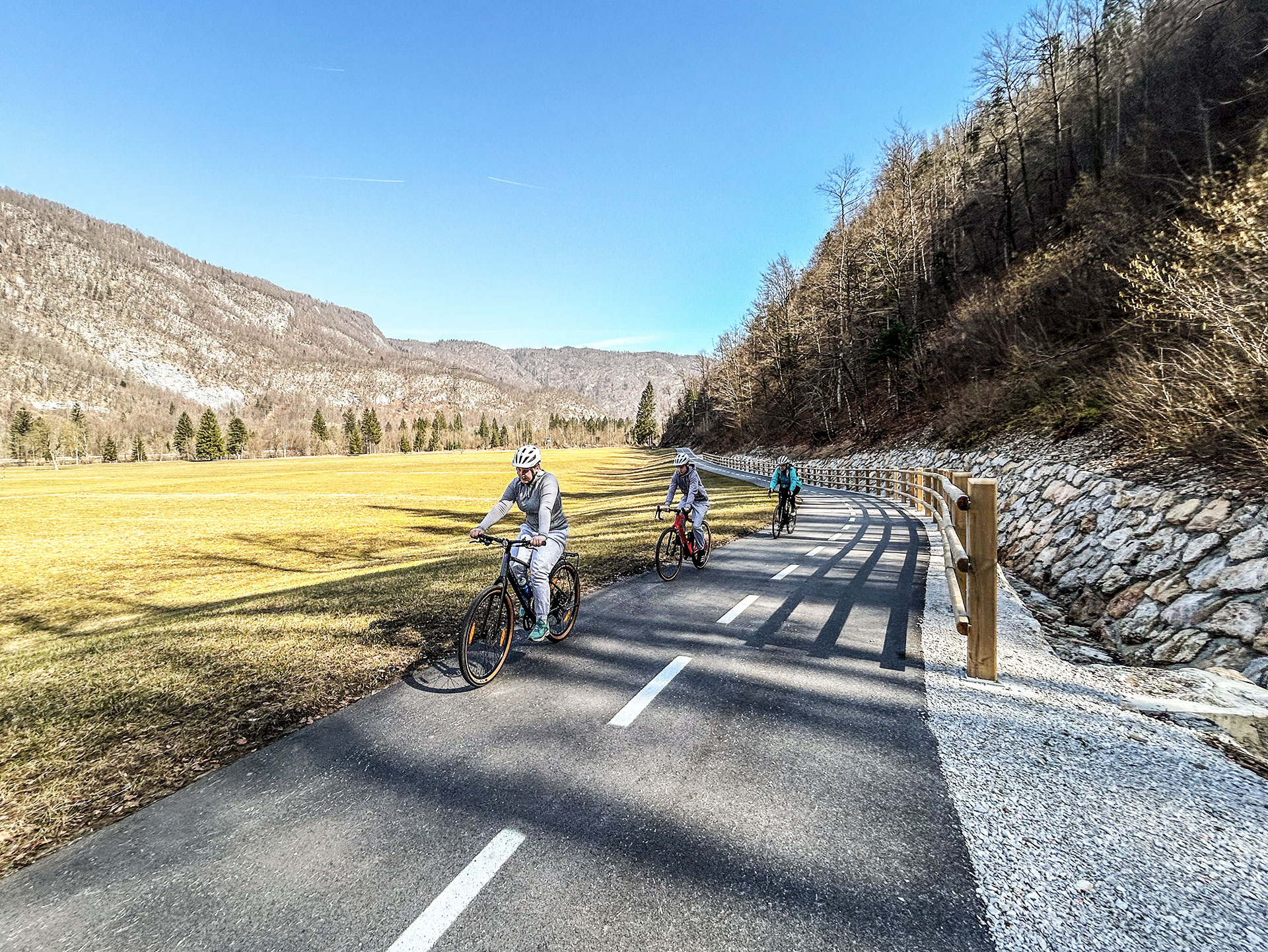 family cycling on bohinka two lakes trail